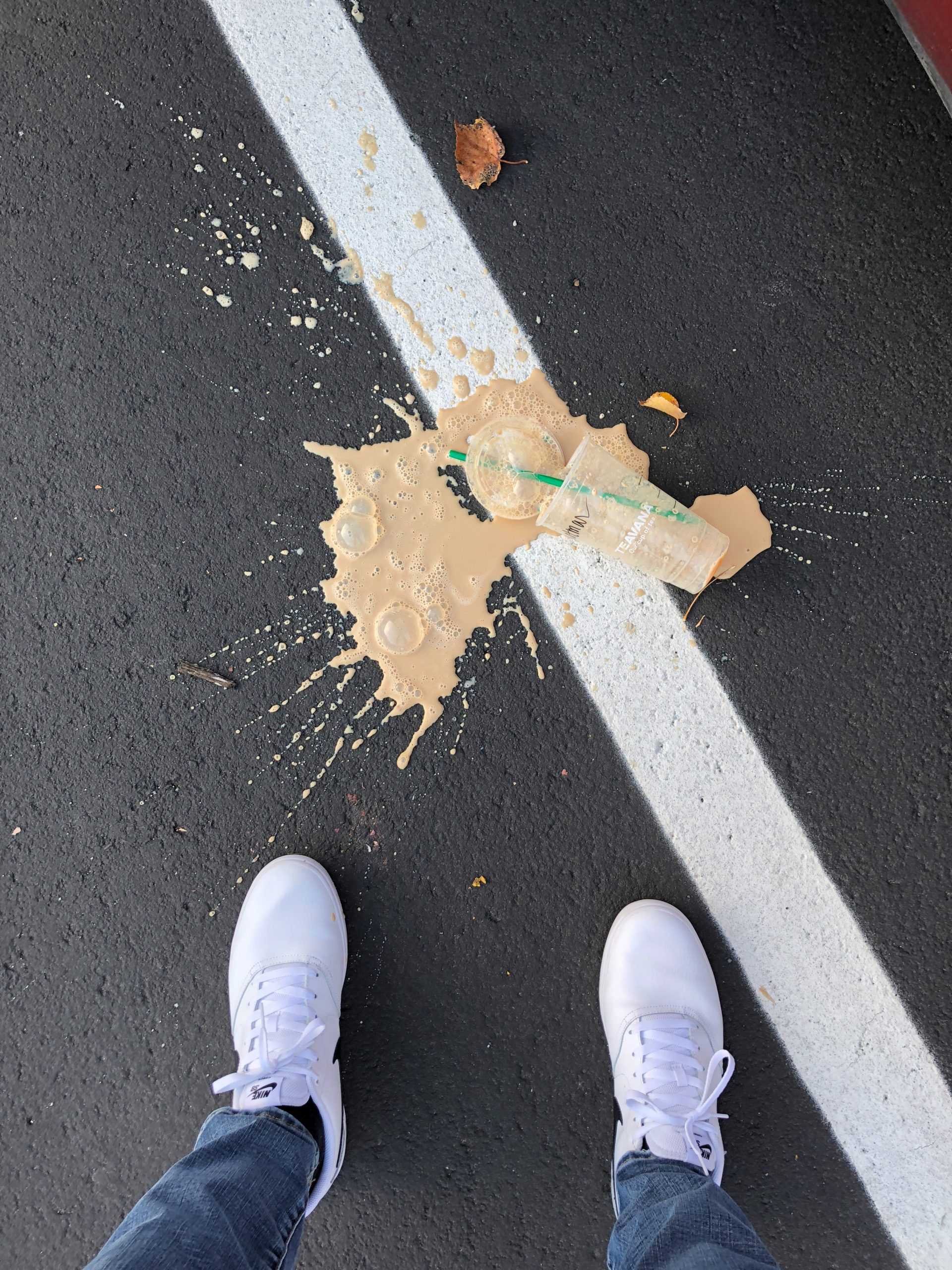A spilt coffee which has been dropped on the floor.